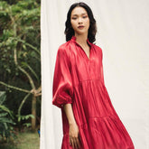 Flowy tiered mini dress in silk with gathered sleeves and soft V neckline